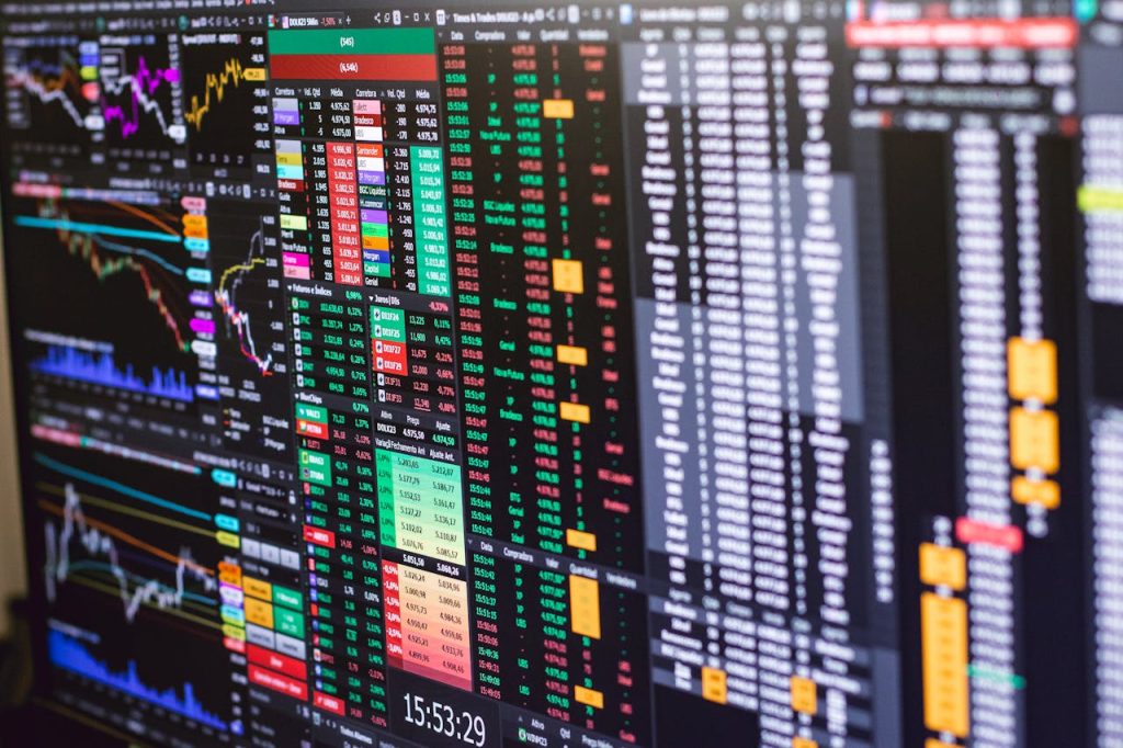 The Art of Drawing Readers In: Your attractive post title goes here Detailed financial trading screen with colorful charts and data representing market fluctuations.